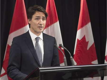 Prime Minister Justin Trudeau reacts to the shooting in the community school in La Loche, as he attends the World Economic Forum in Davos, Switzerland on Jan. 22, 2016.